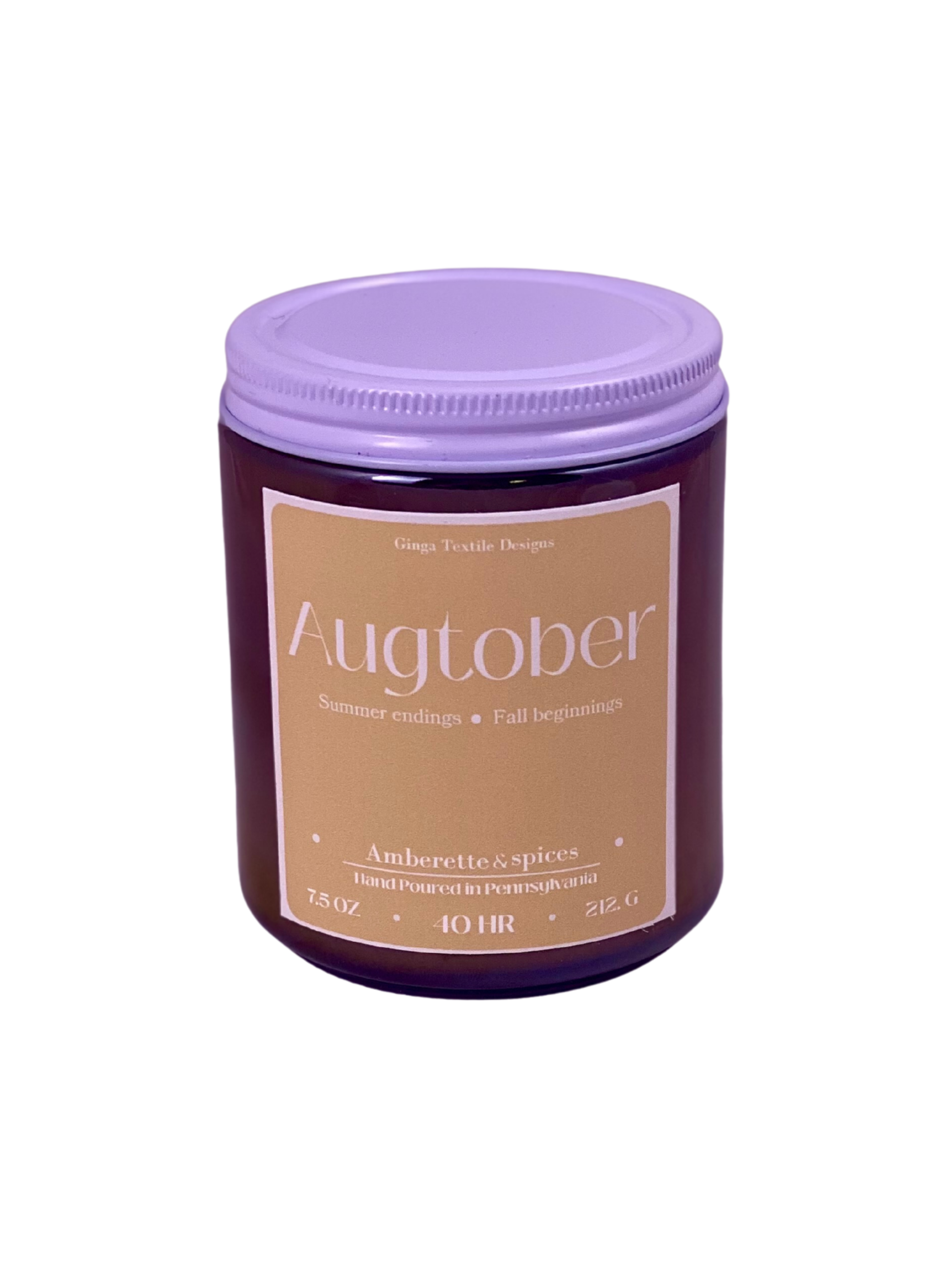 Jar of 'Augtober' candle with a white lid on a white background