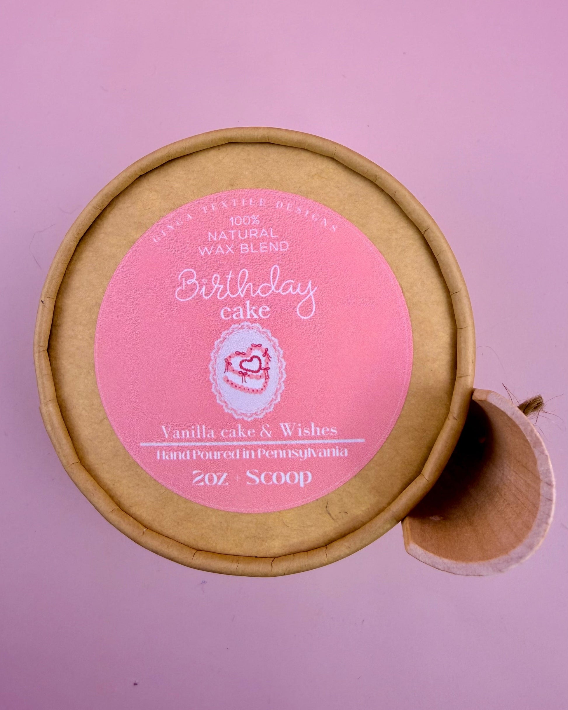 Wax melts labeled 'Birthday Cake' with a pink label on a purple background