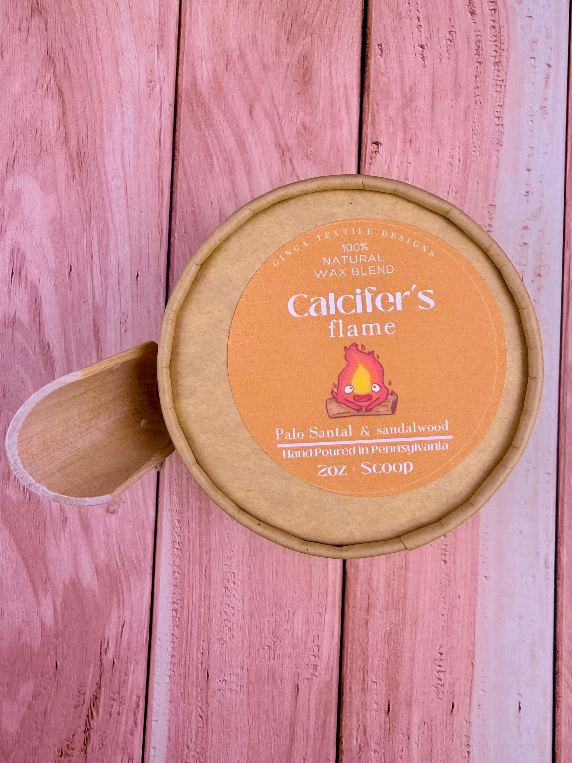 cardboard container labeled 'Calciifer's Flame' on a wooden background