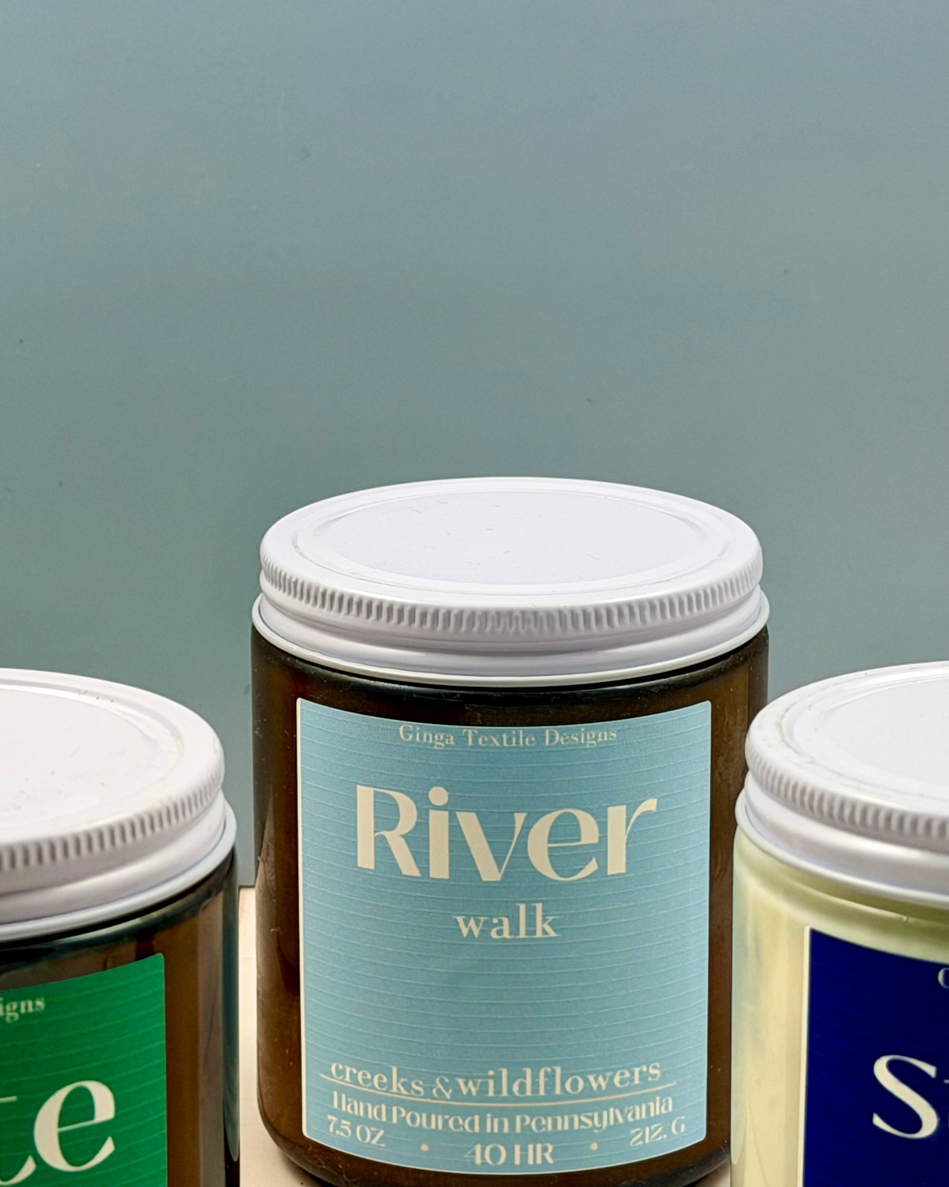 Three jars with labels on a gray background