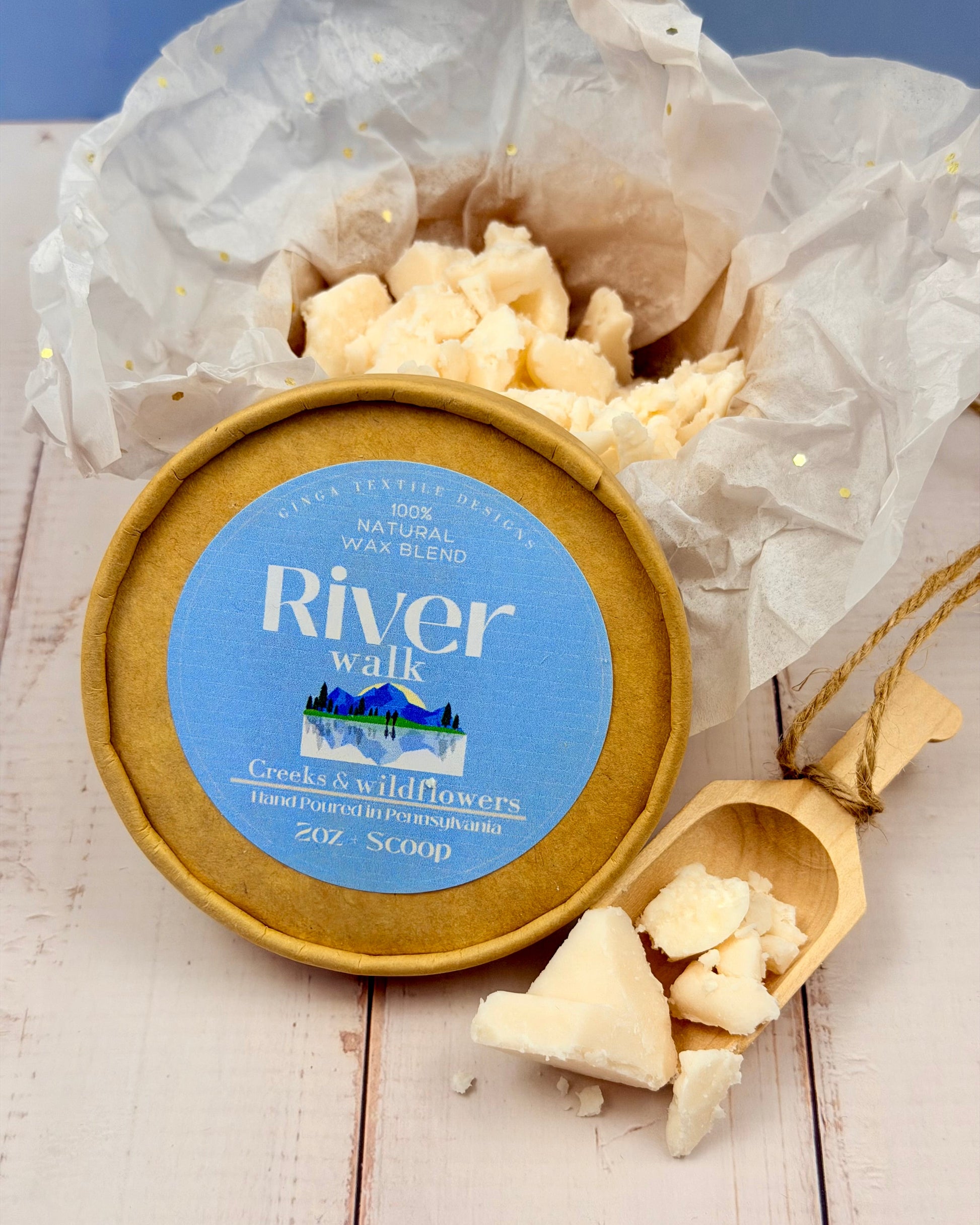 Wax melt container labeled 'River Walk' with wax melts on a wooden surface