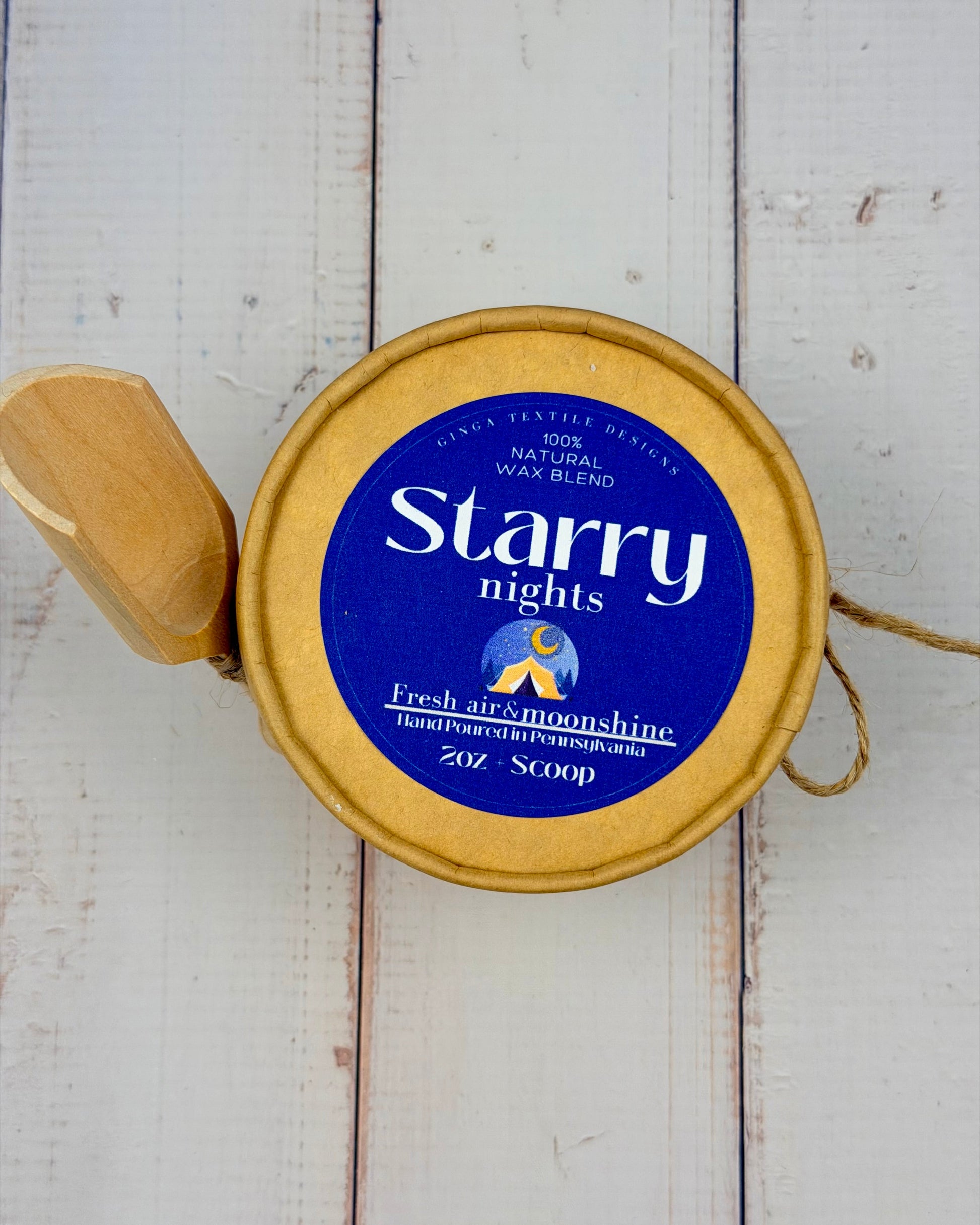 Starry Nights wax melt container on a wooden surface