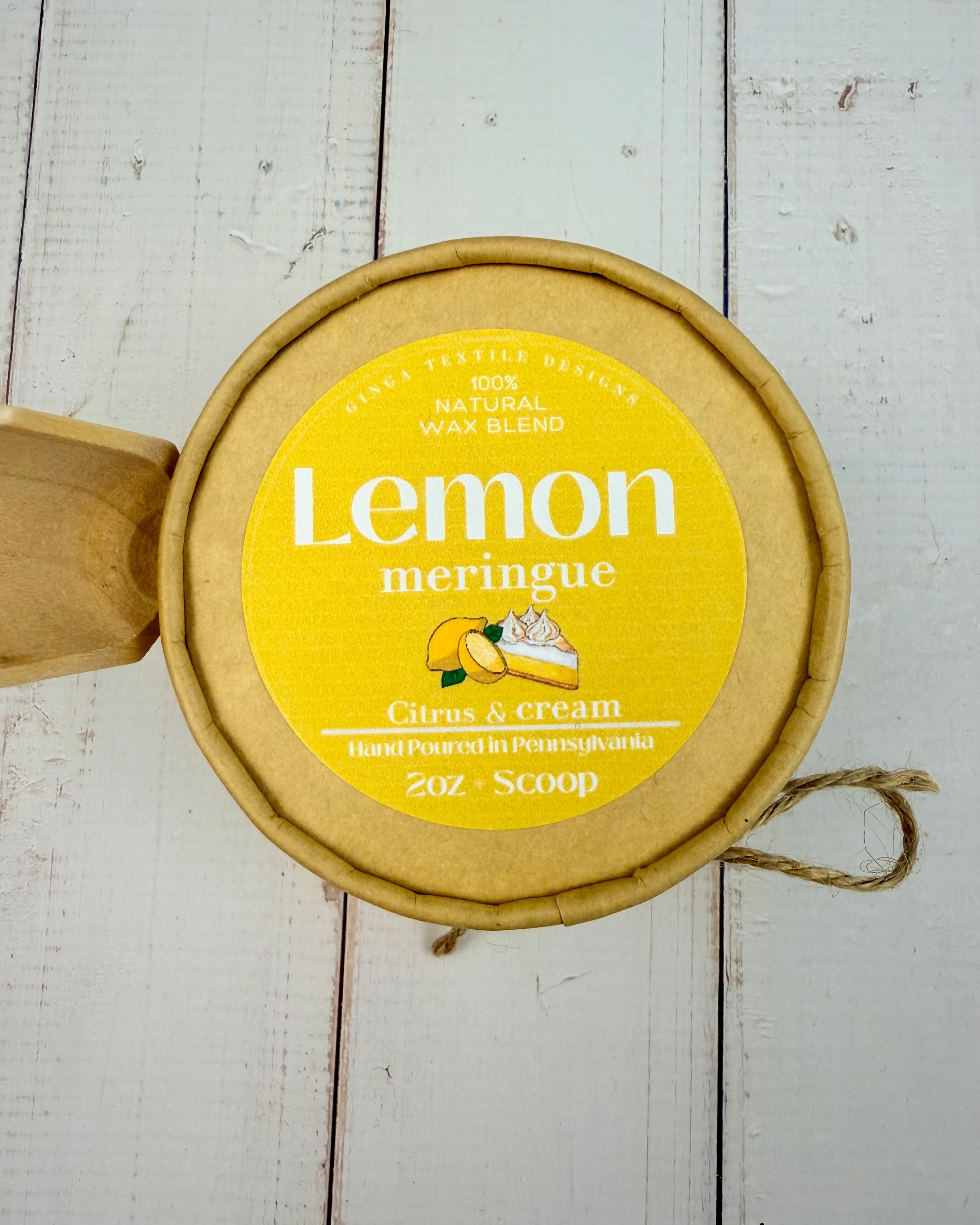 Lemon meringue wax melts on a light wooden background