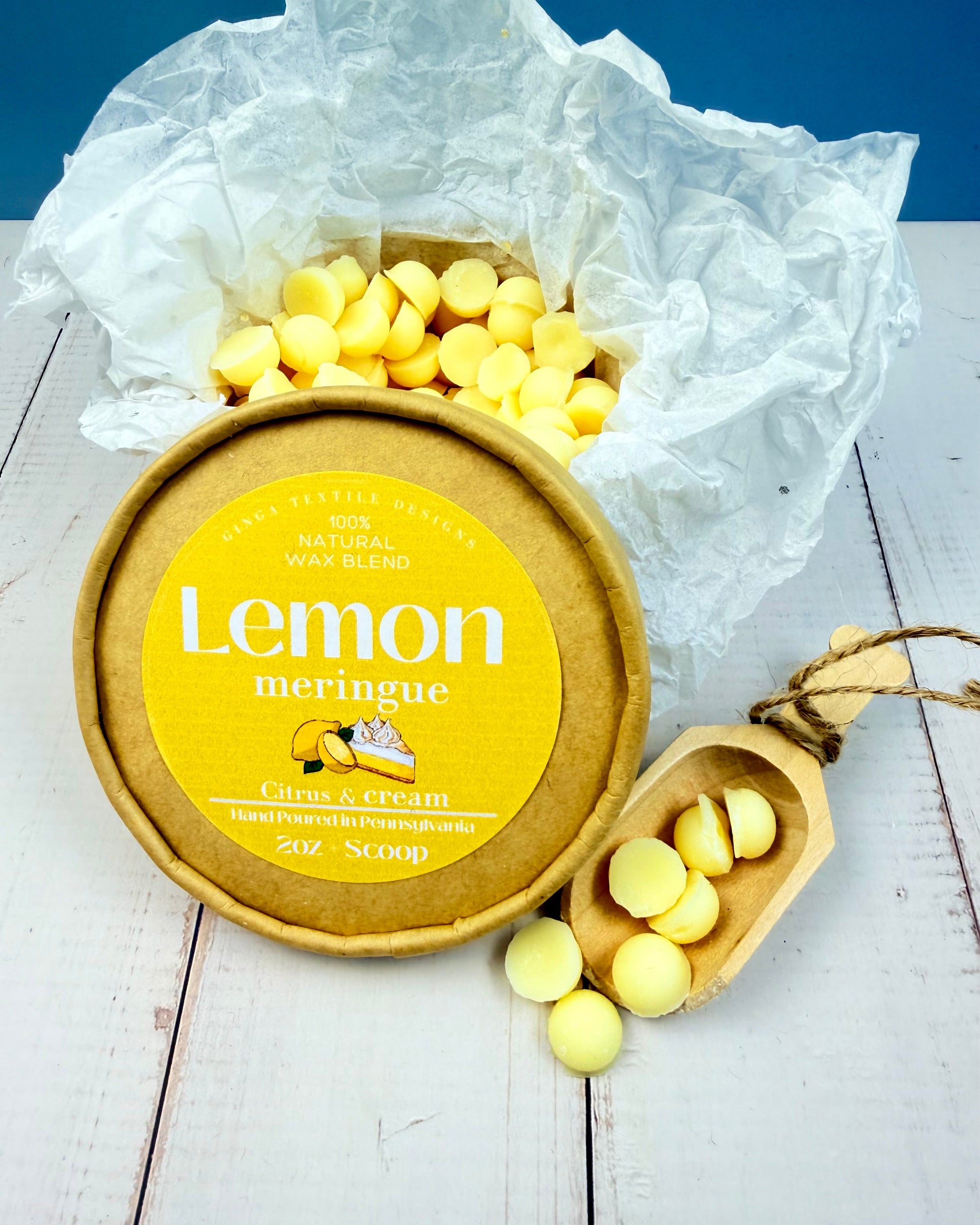 Lemon meringue wax melts with packaging on a wooden surface