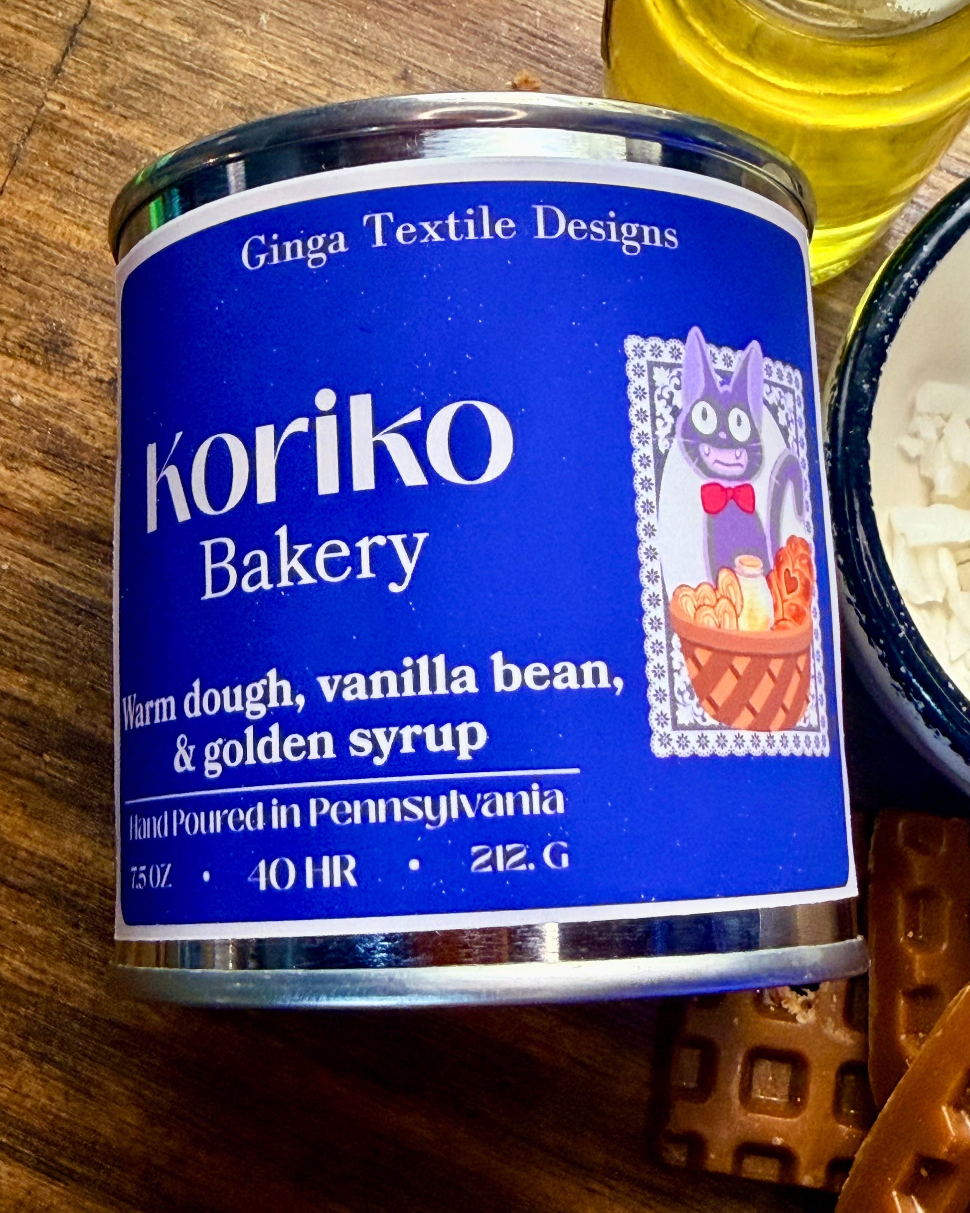 Koriko Bakery canister with blue label on a wooden surface