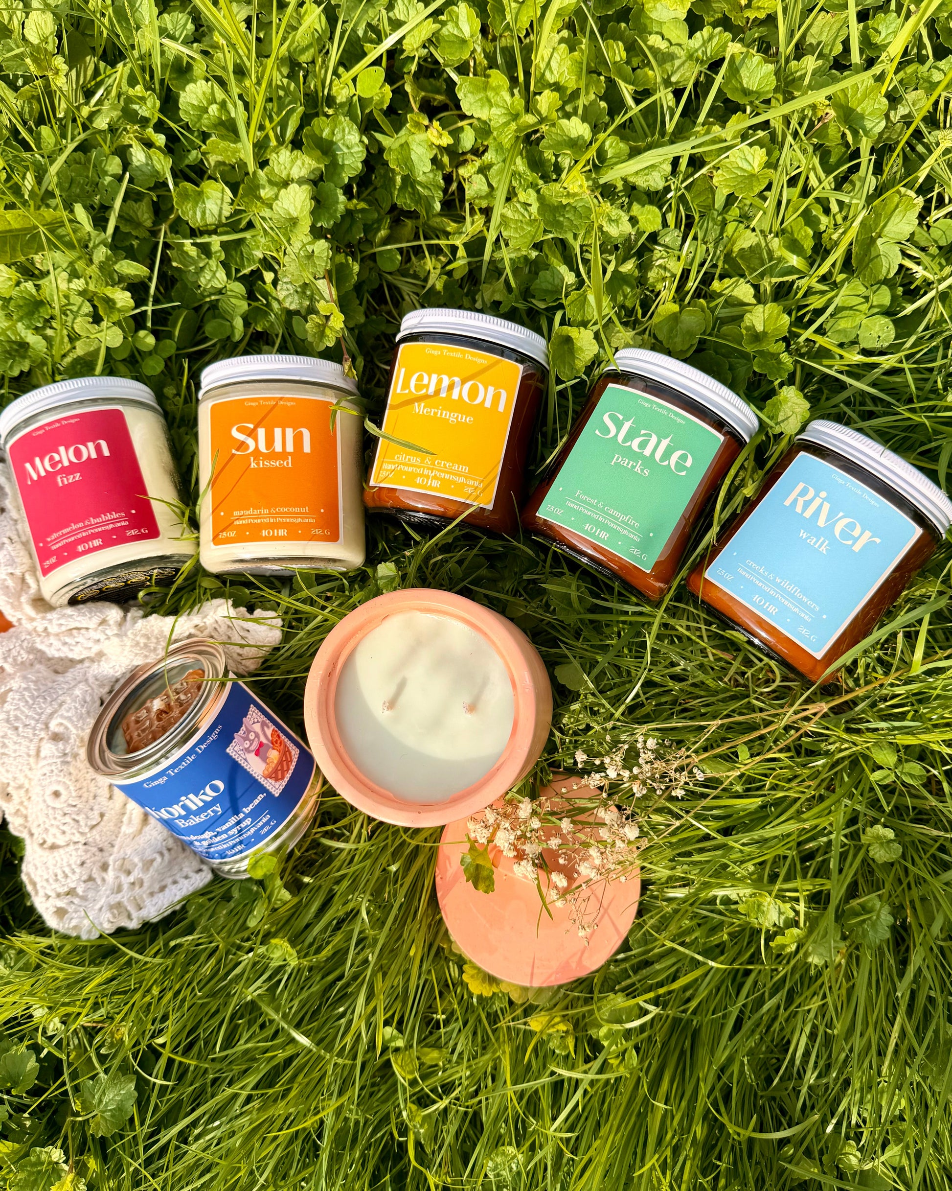Assorted jars with labels on a grassy background