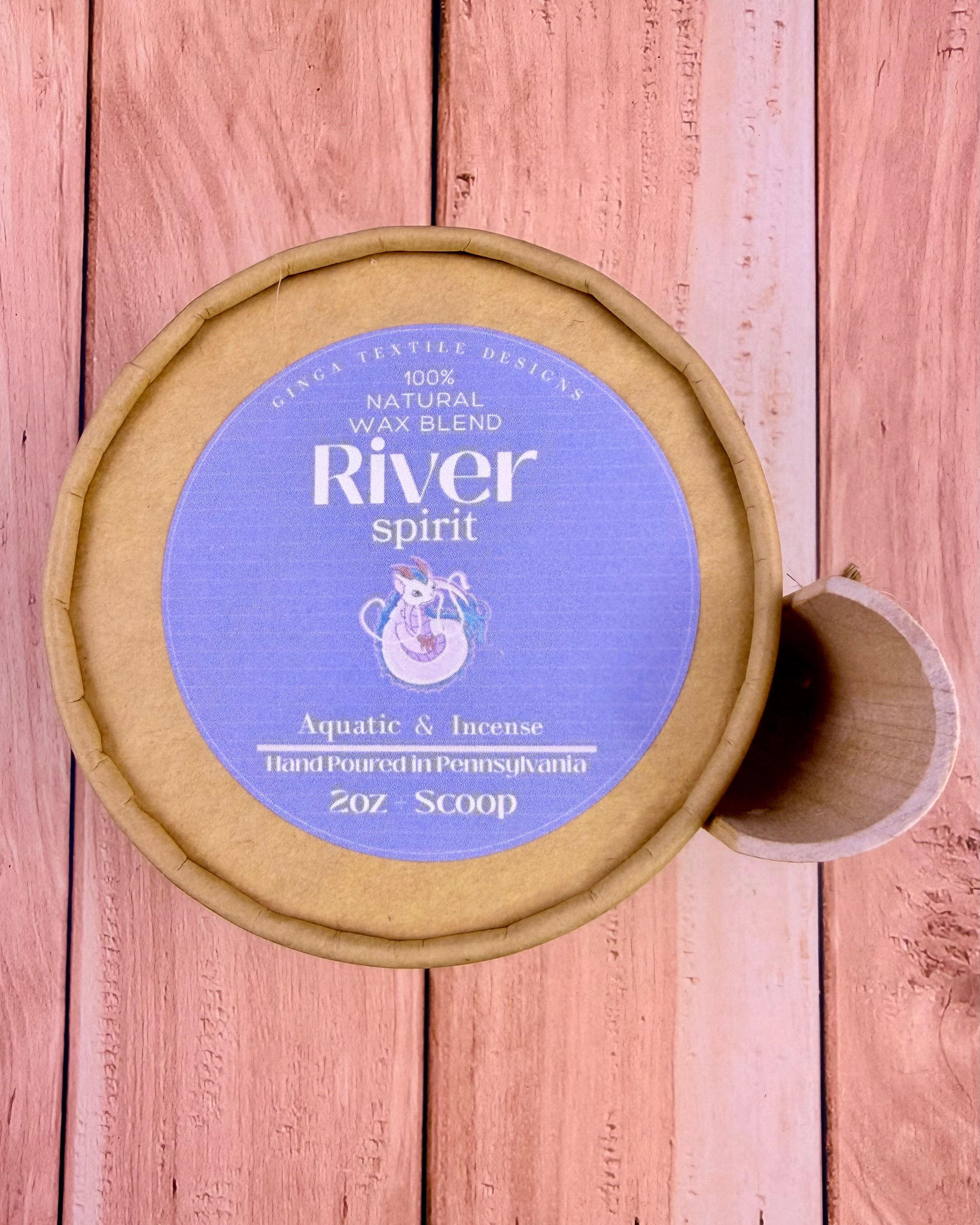 Container of 'River Spirit' wax blend on a wooden surface