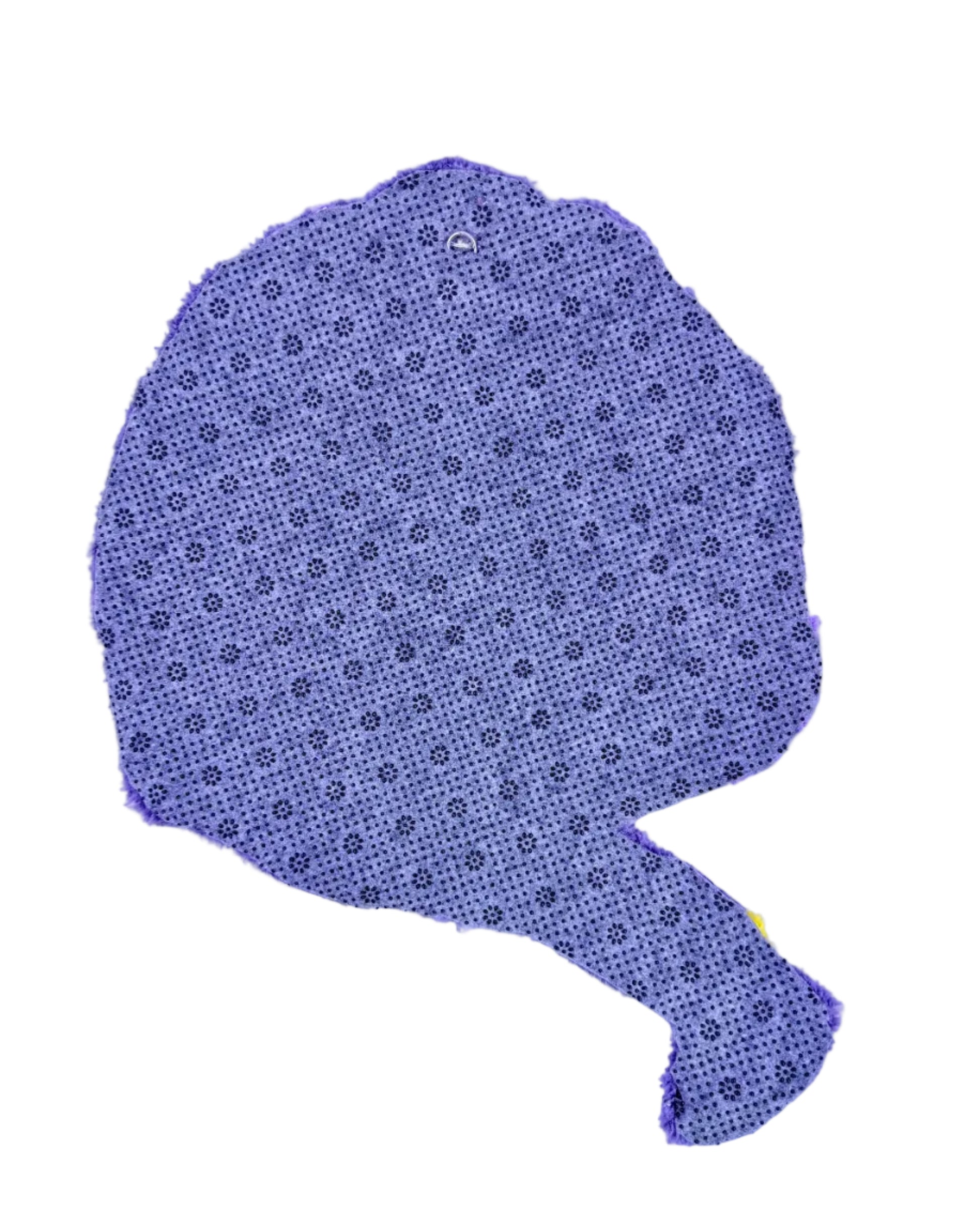 Back of tufted rug with a subtle pattern on a light purple background