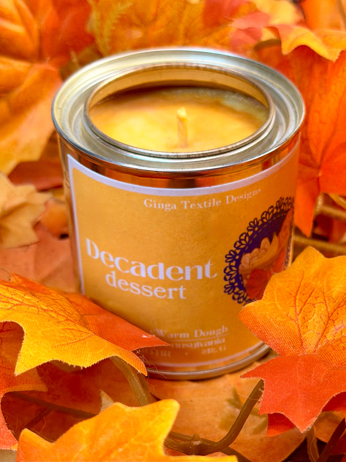Decadent Dessert candle in autumn leaves