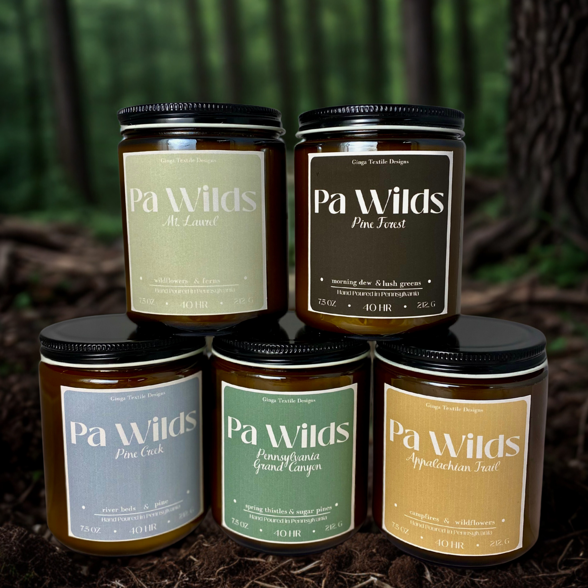 Five jars of Pa Wilds products with labels on a natural background